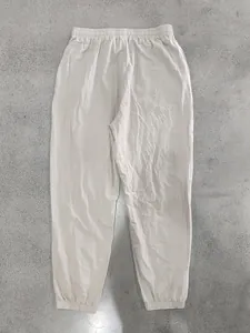 Detailed full-view display of beige cotton linen joggers with elastic waist and cuffs