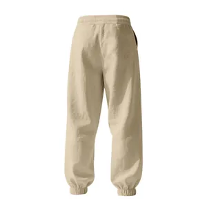 Back view of beige men's linen cotton joggers with elasticated waist and cuffed hems