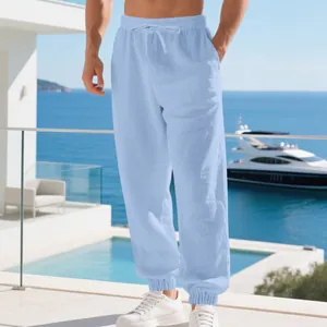 Comfortable light blue breathable linen cotton joggers for men in a summer resort setting.