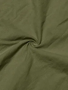 Detailed macro shot of high-quality army green linen fabric texture for men's summer shirt.
