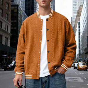 Close-up detail of the orange knit cable pattern on this men's autumn varsity jacket