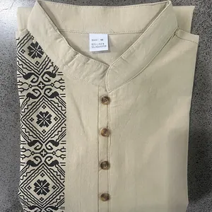 Close-up of men's linen blend Henley shirt with stand collar and black ethnic print