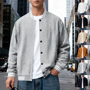 Detailed macro view of men's cable-knit baseball jacket with striped ribbed trims and buttons