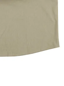 Detailed macro view of the curved hemline and natural linen fabric texture of a men's shirt