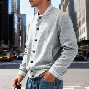 Detailed view of gray cable-knit men's baseball jacket with striped ribbed cuffs