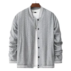 Close-up view of grey men's knit baseball jacket featuring vertical textured patterns and stripes