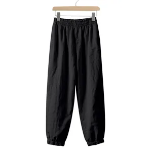 Detailed view of black men's breathable linen casual jogger pants with elastic cuffs
