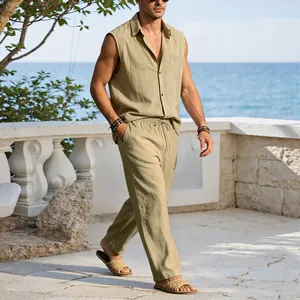 Full-body lifestyle view of men's beige linen sleeveless shirt and casual pants set