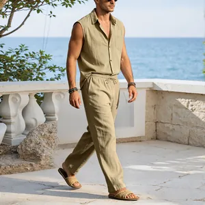 Men's khaki linen sleeveless shirt and pants set shown in a coastal resort setting