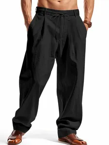 Men's loose fit black linen casual pants with drawstring waist and straight leg design.