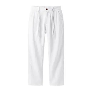 Close-up detail view of white linen casual pants with drawstring and button waist