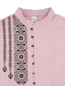 Detail of men's mauve linen henley shirt featuring ethnic print and stand collar
