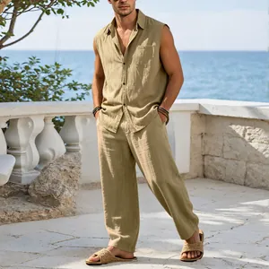 Full-body view of a man wearing a khaki linen sleeveless set on a seaside terrace
