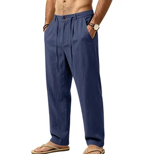 Detailed view of men's blue linen casual trousers with drawstring waist and loose fit