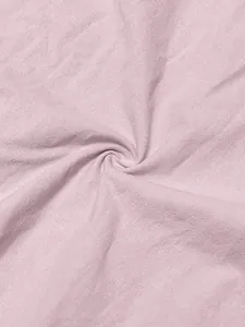 Macro view of soft pink lavender linen fabric texture showing natural breathable weave