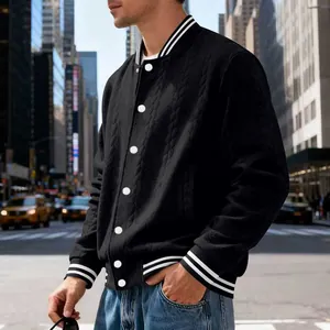 Close-up of men's American style black knit varsity jacket with white stripes.