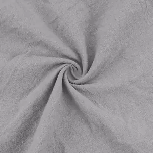 Macro close-up detail showing the breathable grey cotton linen fabric texture for men's joggers