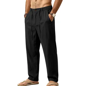 Detail view of men's casual black linen drawstring trousers featuring a relaxed straight-leg fit