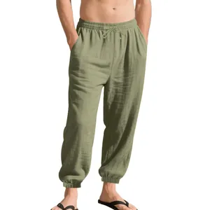 Detailed view of men's olive green breathable linen jogger pants with drawstring