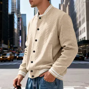 Close-up of men's beige cable-knit varsity jacket featuring classic striped ribbed detailing