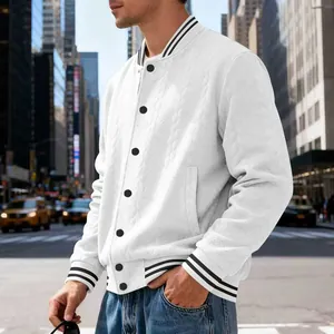 Close-up of white knitted varsity jacket with striped cuffs and black buttons.