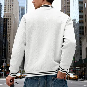 Detailed back view of a white cable-knit bomber jacket with striped ribbed trims
