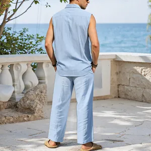 Men's blue linen sleeveless shirt and pants set shown from the back in holiday setting