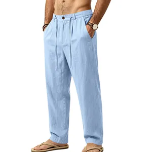 Close-up detail of light blue linen trousers featuring a comfortable drawstring waist design