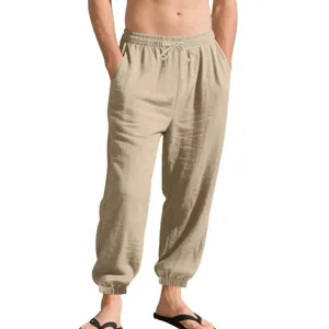 Close-up of breathable men's linen jogger pants with elastic drawstring waist.
