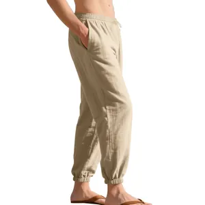 Detail view of men's breathable linen jogger pants in beige with drawstring waist.