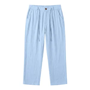 Front view of light blue men's linen drawstring trousers on a white background