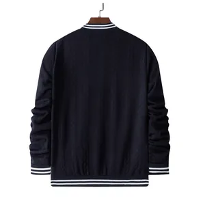 Back view of navy blue cable-knit men's bomber jacket with striped trim