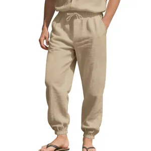 Detail of breathable men's linen jogger pants with elastic drawstring waist in beige