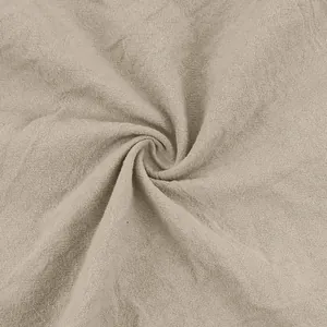 Close-up of breathable beige cotton linen fabric showing natural texture and weave