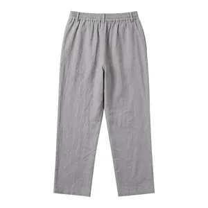 Back view of men's loose casual linen trousers in grey with elastic waist