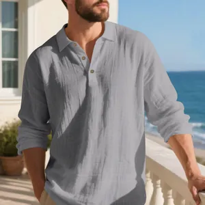 Detail view of a men's grey linen long sleeve shirt with a polo collar for beach vacation.
