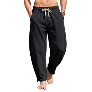 Pantalon large hip-hop noir pour hommes avec coutures incurvées et fentes aux chevilles