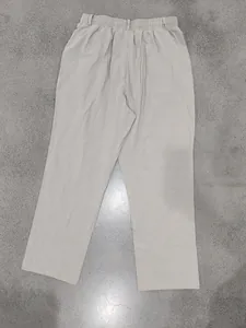 Back view of men's loose linen casual trousers with elastic waistband and drawstring.