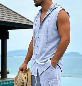 Close-up detail of men's casual light blue sleeveless linen hooded shirt outdoors