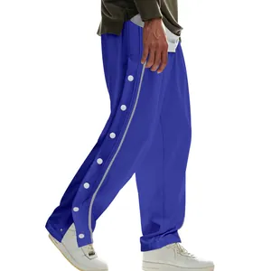 Vue latérale du pantalon de basket bleu pour homme avec boutons-pression latéraux