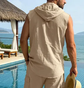 Detailed back view of men's casual khaki linen hooded vest at a tropical resort pool.