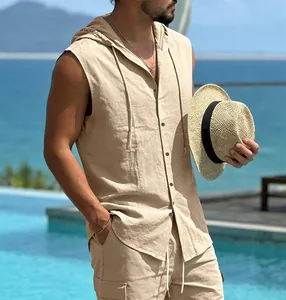 Detailed view of men's casual beige linen hooded sleeveless shirt at a beach resort.