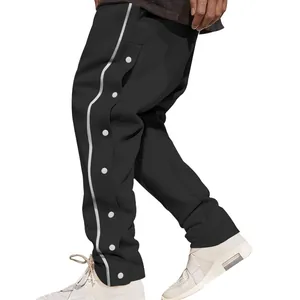 Détail du pantalon de basket-ball noir style hip-hop avec boutons-pression pour hommes