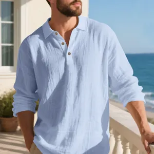 Close-up of light blue linen shirt texture with button-down lapel on a seaside balcony