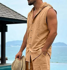 Detail of men's sleeveless linen hooded shirt with buttons in a beach resort setting