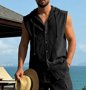 Detailed view of men's casual black linen hooded sleeveless shirt in seaside setting
