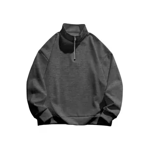 Close-up showing the premium texture and half-zip detail of grey men's sweatshirt