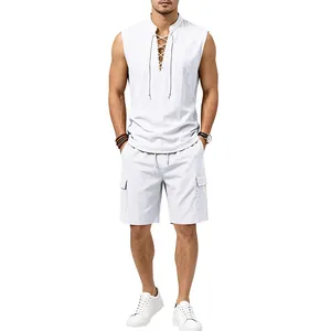 Full body view of a man wearing a white sleeveless linen shirt and cargo shorts set