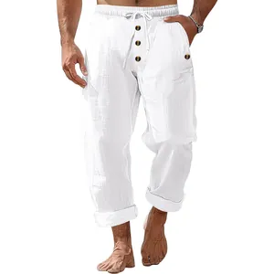 Macro view of men's casual white linen trousers featuring drawstring waist and buttons