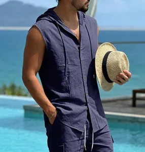 Detailed view of men's navy blue sleeveless hooded linen shirt in a resort poolside setting